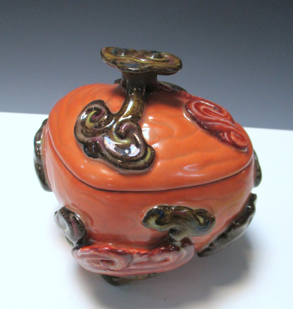 A lingzhih shaped box and cover, gilt seal mark of Qianlong, the coral red ruyi shape moulded with