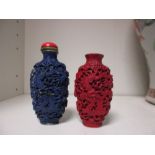 Two imitation lacquer snuff bottles and a coral topped stopper, both similarly moulded in relief