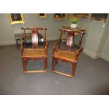 A pair of late 18th/early 19th century northern Chinese elm 'Official's Hat' style armchairs, with