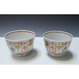 A pair of 19th century 'Baragon Tumed' tea bowls, the exteriors painted with a band of figures and