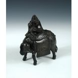 A 19th century bronze elephant and rider censer, the caparissoned pachyderm standing with its