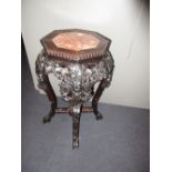 A 19th century marble inset hardwood stand, the octagonal top with beading above the pierced and