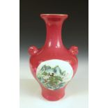 A Republic Period vase, the pronounced shoulders of the baluster shape supporting mask handles,