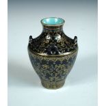 A gilt blue ground vase, four character seal mark of Qianlong, four lug handles raised on the