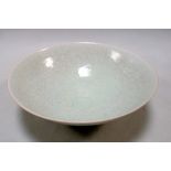 A Qingbai bowl, the misty blue glaze with a slight crackle over incised lotus scrolling on the