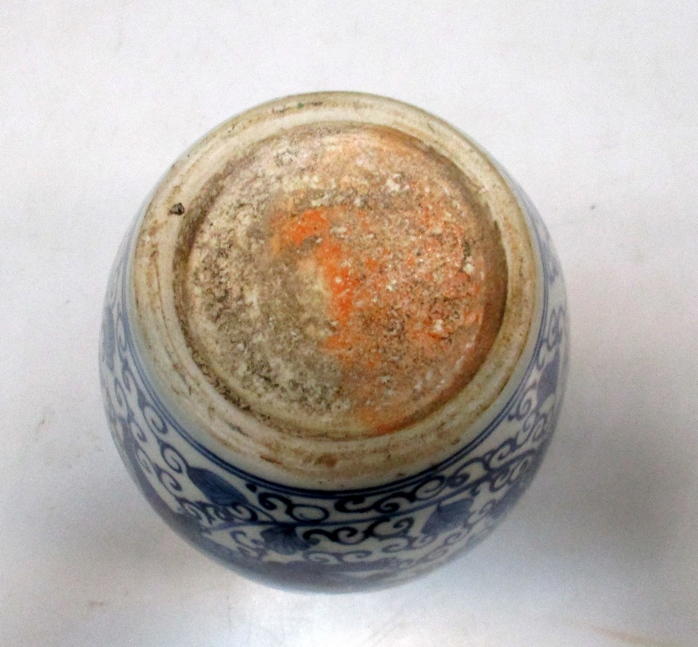 A Transitional style blue and white jar, painted with two Buddhist lions running against flowering - Image 3 of 4