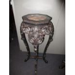 A 19th century hardwood marble inset stand, the edge of the octagonal top with bead edge above an