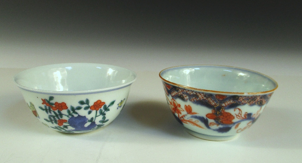 A wucai cup and another in Imari palette, the exterior of the first painted with chickens, six