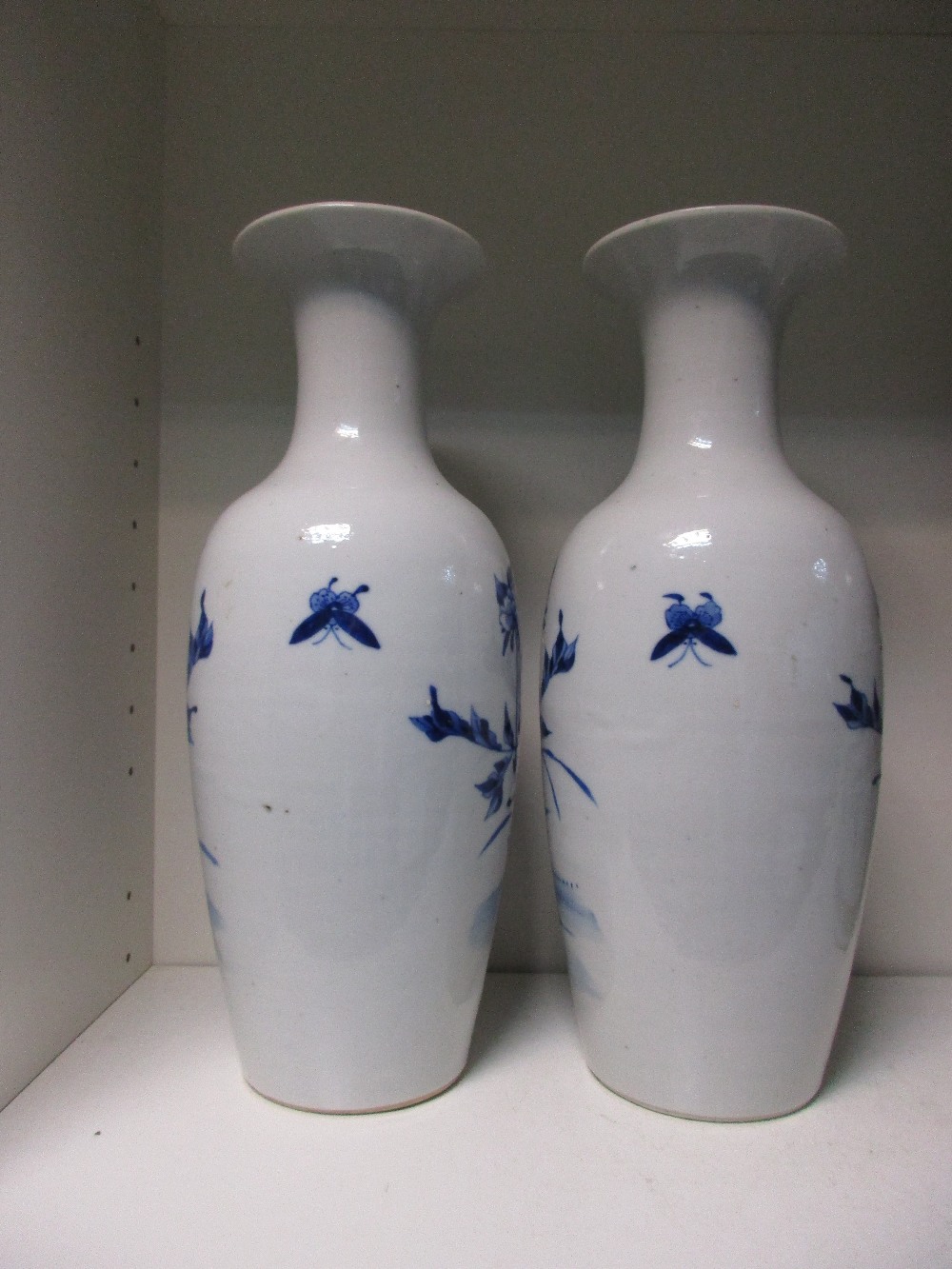 A pair of late 19th/early 20th century blue and white vases, magnolia flowering on the waisted - Image 2 of 3