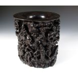 A zitan brush pot, the exterior pierced and carved with the eight Daoist immortals riding a