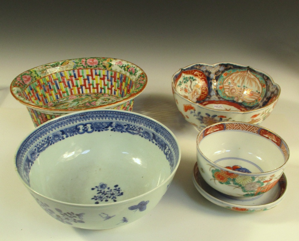 A Canton basket, a blue and white bowl, a covered Imari bowl and another, the oval centre of the