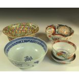 A Canton basket, a blue and white bowl, a covered Imari bowl and another, the oval centre of the