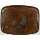 An incised lacquered wood tray signed Zeshin, the rounded rectangular shape with a seated and