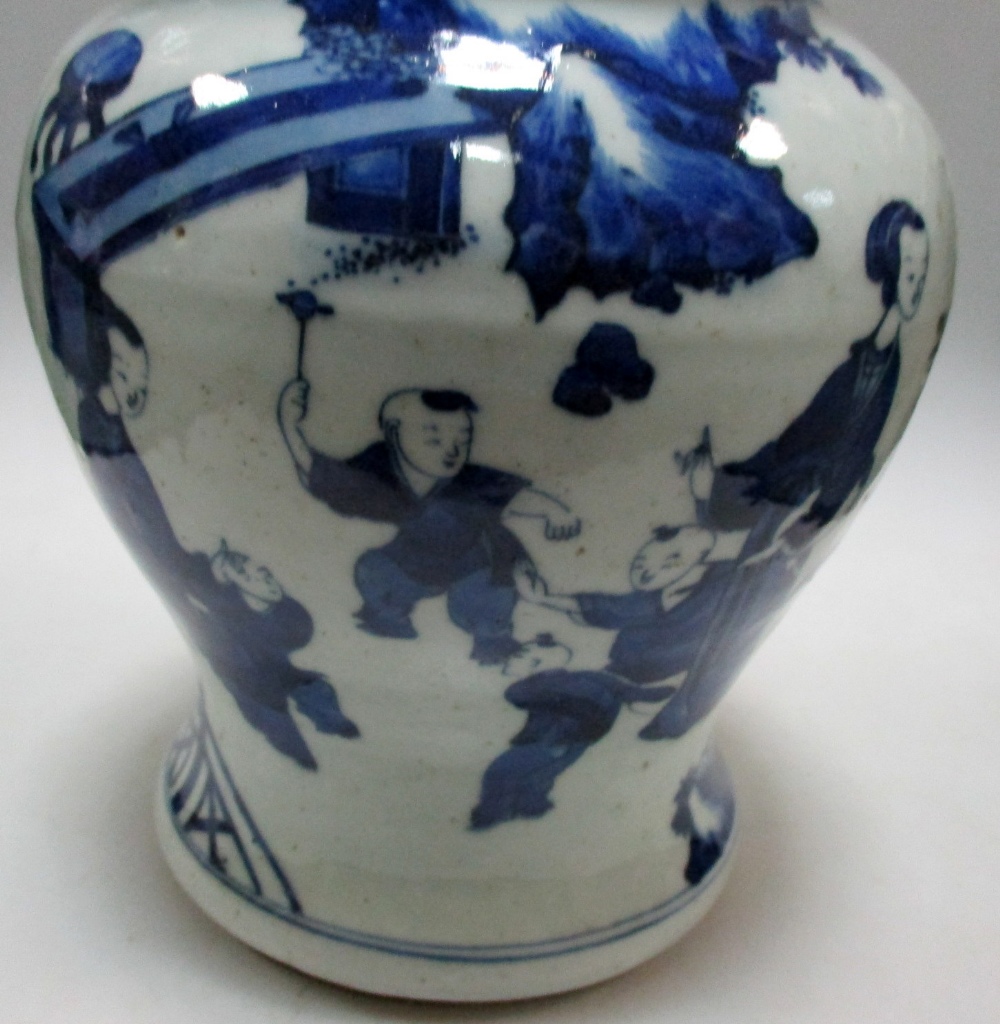 A Transitional style blue and white jar and cover, the baluster shape painted with mothers