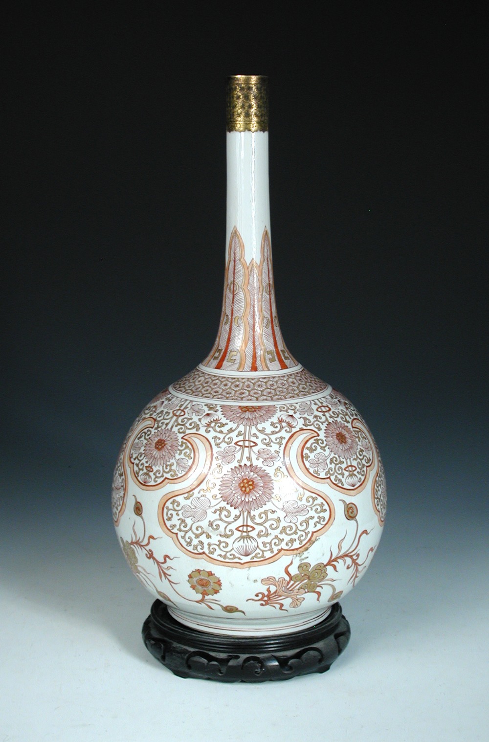 An iron red and gilt bottle vase, period of Kangxi, the rim mounted with gilt metal collar