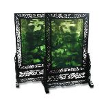 A pair of 20th century spinach green jade screens with hardwood frames and stands, each