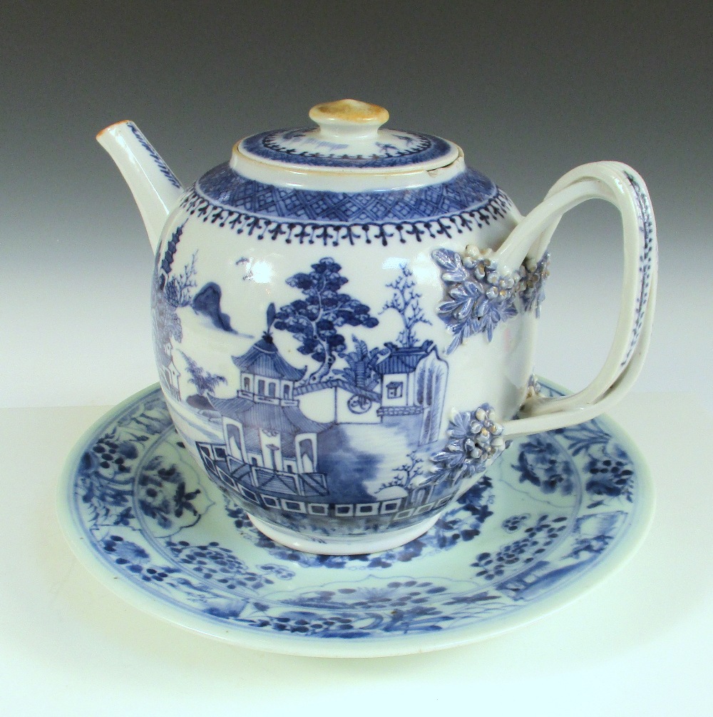 A late 18th century Chinese blue and white tea pot together with a later plate, the tea pot