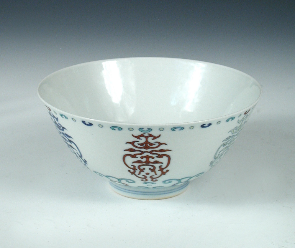 A wucai bowl, six character mark of Yongzheng, the exterior with alternating coloured scrolls in bud