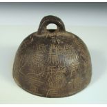 A lead weight for a steelyard balance, the domed shape incised with archaic characters below the
