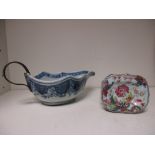 An 18th century Chinese trencher salt and blue and white sauceboat, the salt painted with a