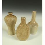 Two crackleware miniature vases and a snuff bottle, the tallest of bottle shape, 8.5cm (3.25in)