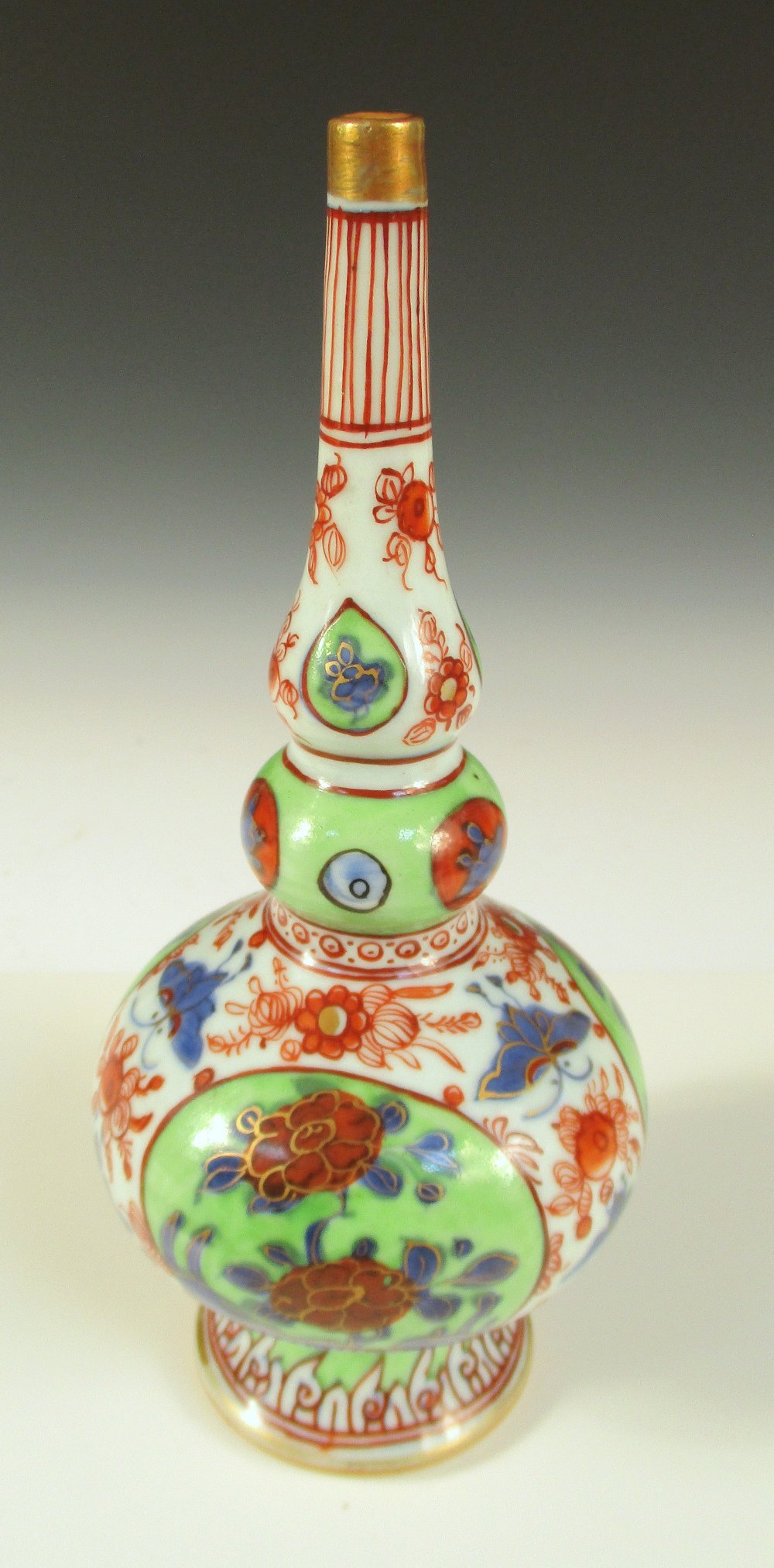 A later coloured 18th century rose water sprinkler, the tall neck above the three lobes of the gourd