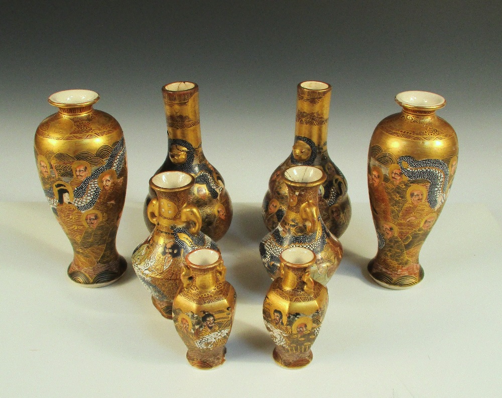 Four pairs of Satsuma vases, each painted with Kwannon seated amongst lohans intertwined with