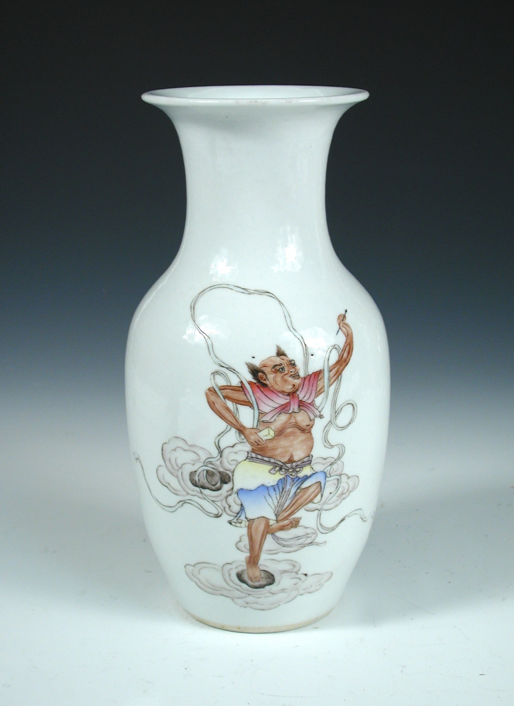 A Republic Period vase, one side of the baluster shape painted with a deity dancing on clouds with a