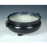 An aubergine glazed censer bowl, period of Kangxi, two lug handles below a broad rim, the