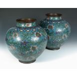 A pair of 19th century cloisonne vases, the shoulders of the spherical bodies worked with ruyi bands