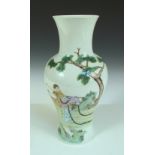 A Republic Period baluster vase painted with a lady harvesting lingzhi growing amongst rocks below a