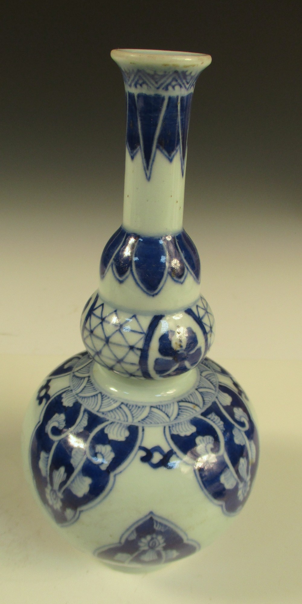 A pair of Kangxi style blue and white double gourd vases, the cylindrical necks with flared rims - Image 7 of 9