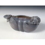 A 20th century grey agate brush washer carved in the form of a lingzhih fungus head with a dragon on