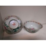 A pair of 19th century famille rose bowls, Qianlong seal marks in red, each exterior painted with