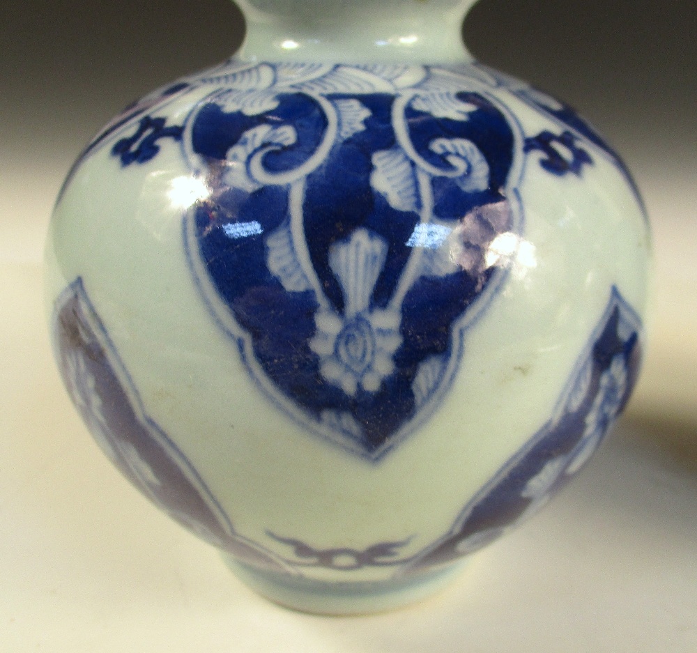 A pair of Kangxi style blue and white double gourd vases, the cylindrical necks with flared rims - Image 4 of 9