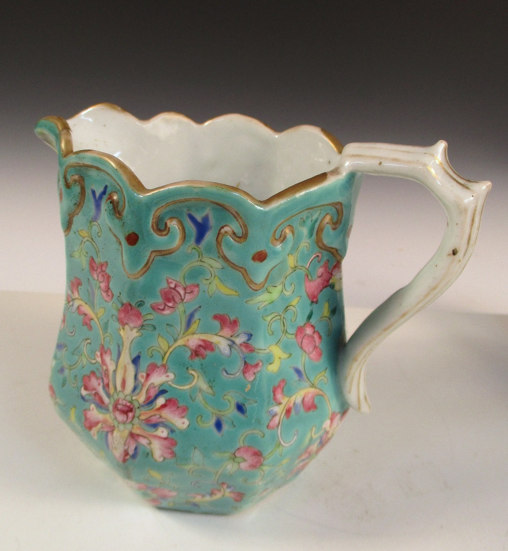 A Canton and three 18th century jugs, the facetted exterior of the first with flowers on a turquoise