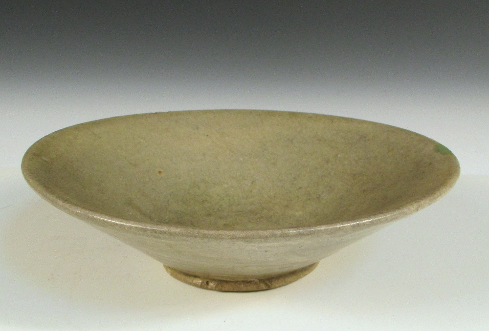 A Song celadon rounded conical bowl, the finely crackled grey green glaze overall, 15cm (6 in)