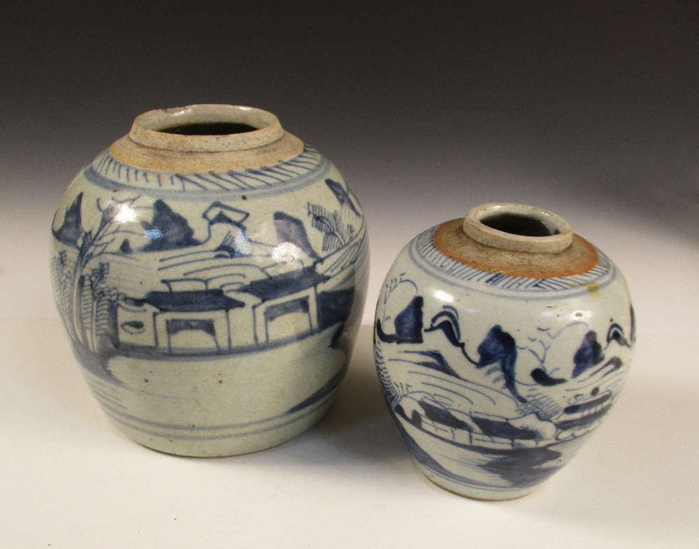 Two 19th century blue and white jars, each painted with island scenes below glaze free rims, 18cm (7