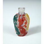 A five colour glass overlay snuff bottle, the aisted clear glass neck above an ovoid body with