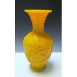 A Pekin yellow glass vase, the exterior of the baluster shape carved in relief with four dragons