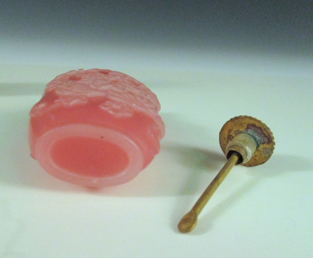 Two moulded glass snuff bottles and a stopper, the flattened bottle shape of the amber example - Image 3 of 6