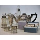 A small silver teapot and other silver