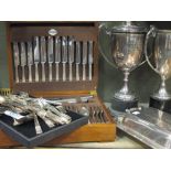 Two silver plated trophy cups, a community plate cutlery set etc