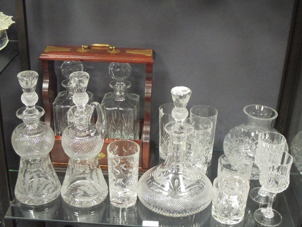 A tantalus for two decanters, various drinking glasses and decanters