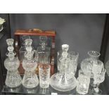 A tantalus for two decanters, various drinking glasses and decanters