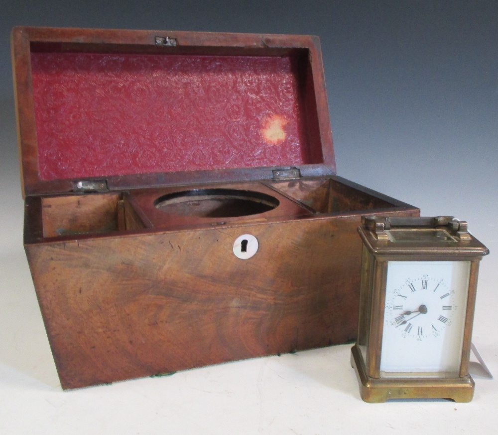 A brass cased carriage clock and a mahogany tea caddy (2)