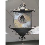 A pair of black frame glazed triangular form lanterns