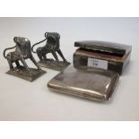 A silver cigarette box, another case and two Indian lions