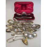 A silver christening set, cased and a quantity of silver spoons etc