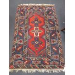 A blue ground woolen rug together with one similar, 127 x 195cm and 120 x 186cm (2)